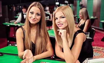 team_two_female_dealers_black_dress_green_table_sm_1760274762927.jpg